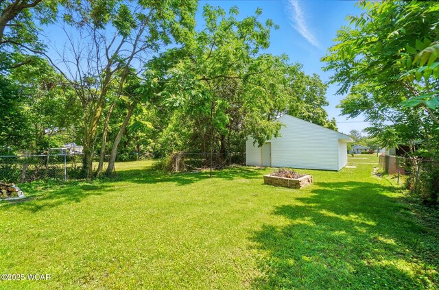 1151 S Central Ave, Lima, OH 45804 - view of yard featuring a storage unit