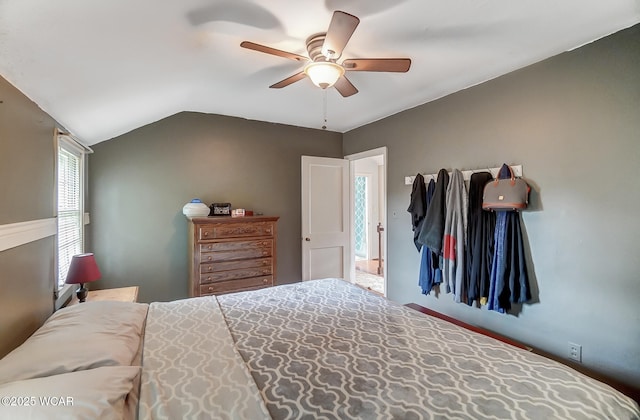 bedroom with lofted ceiling and ceiling fan