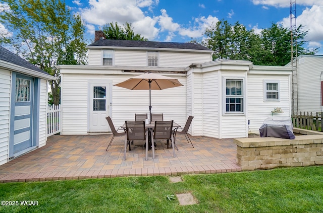 rear view of property featuring a patio area