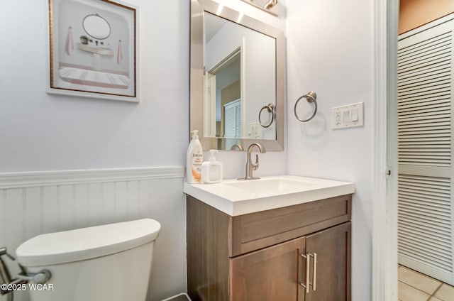 bathroom featuring toilet and vanity