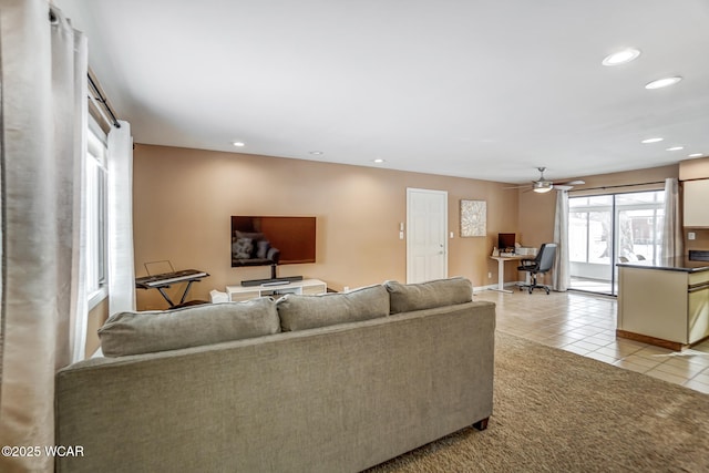 living room with light tile patterned floors and ceiling fan