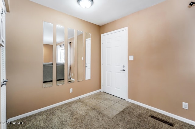 foyer with light tile patterned flooring