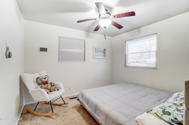 carpeted bedroom featuring ceiling fan