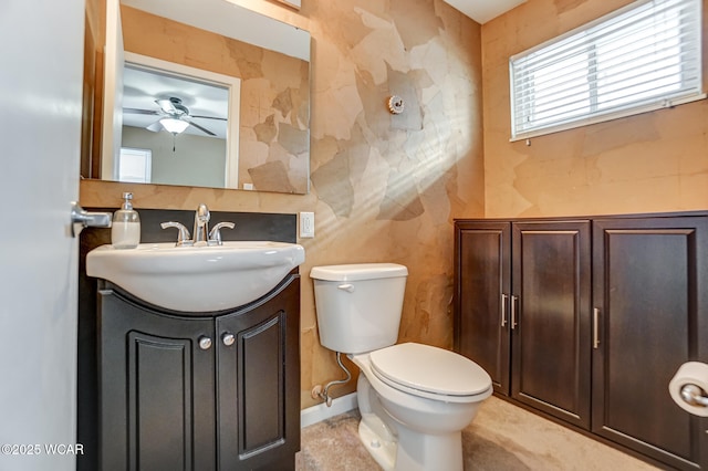 bathroom featuring ceiling fan, vanity, and toilet