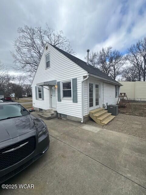 rear view of house featuring entry steps