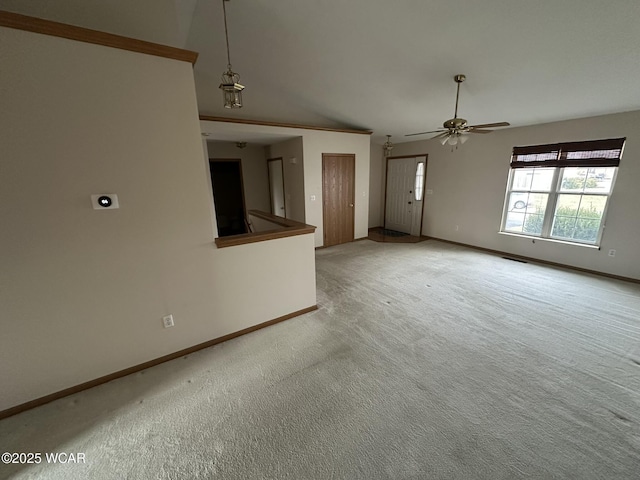 unfurnished living room with ceiling fan and light carpet