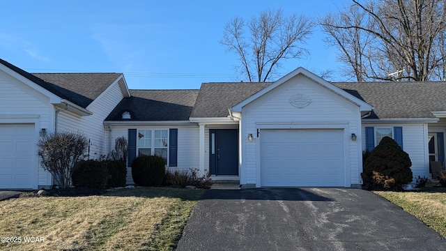 single story home featuring a garage and a front yard