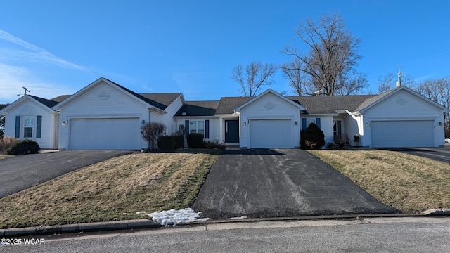 ranch-style home with a garage and a front yard