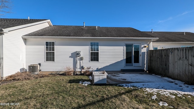 back of property featuring a yard, cooling unit, and a patio area