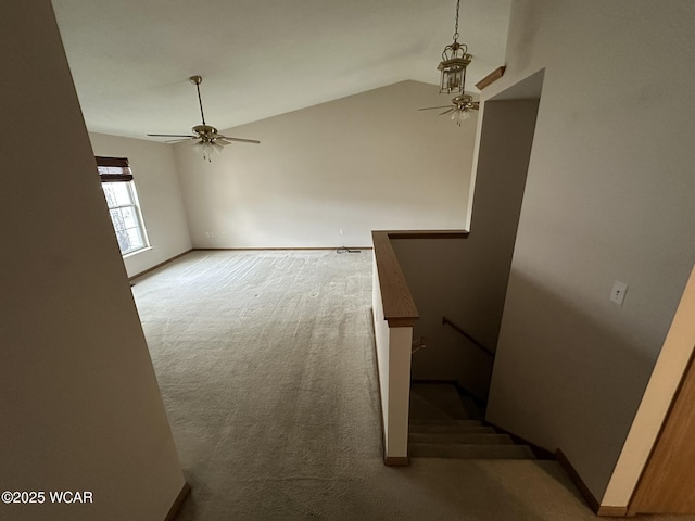 interior space with lofted ceiling and ceiling fan