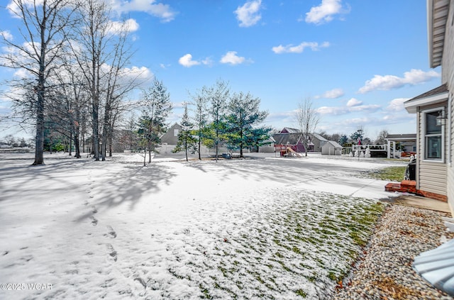 view of yard layered in snow