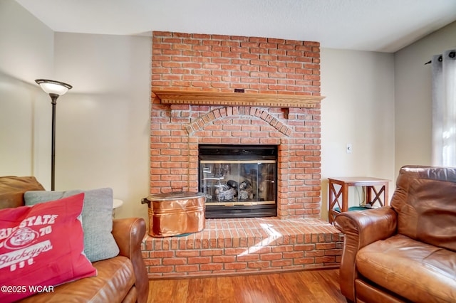 living room with a fireplace and hardwood / wood-style floors