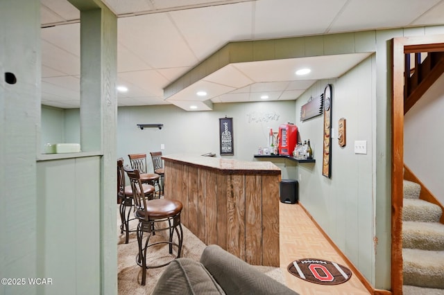 bar featuring bar and stairs