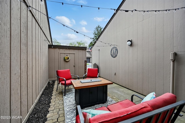 view of patio / terrace featuring an outdoor fire pit