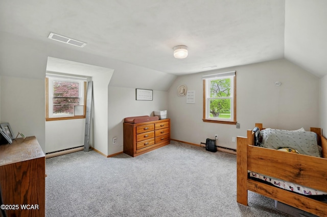 2636 Debbie Dr, Elida, OH 45807 - carpeted bedroom featuring baseboard heating, vaulted ceiling, and baseboards