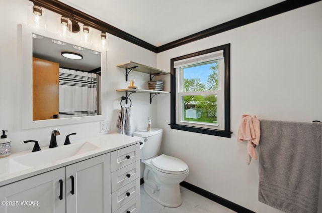 2636 Debbie Dr, Elida, OH 45807 - bathroom with toilet, vanity, crown molding, and baseboards