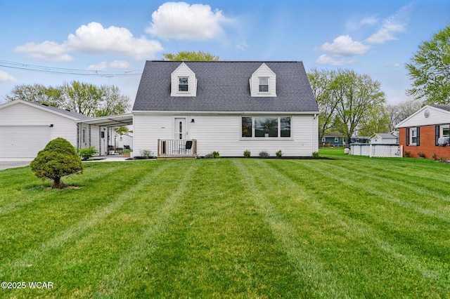 2636 Debbie Dr, Elida, OH 45807 - cape cod home featuring a front lawn, a carport, and roof with shingles
