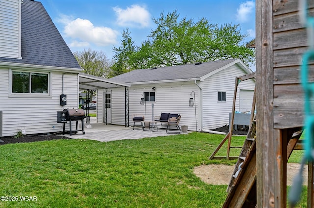 2636 Debbie Dr, Elida, OH 45807 - rear view of property featuring a patio, a shingled roof, a yard, and outdoor lounge area