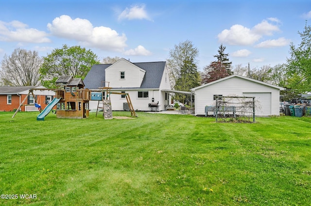 2636 Debbie Dr, Elida, OH 45807 - back of property featuring a playground, a yard, a garage, and a patio area