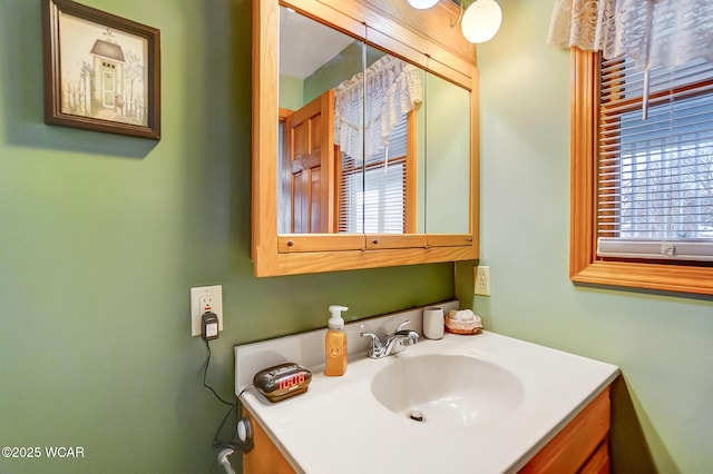 bathroom with a healthy amount of sunlight and vanity