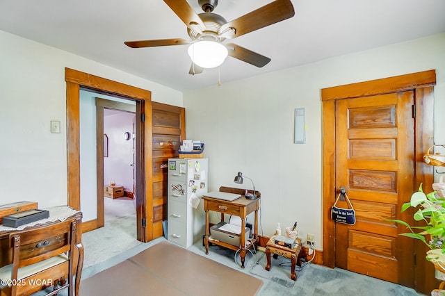 interior space with ceiling fan and carpet flooring