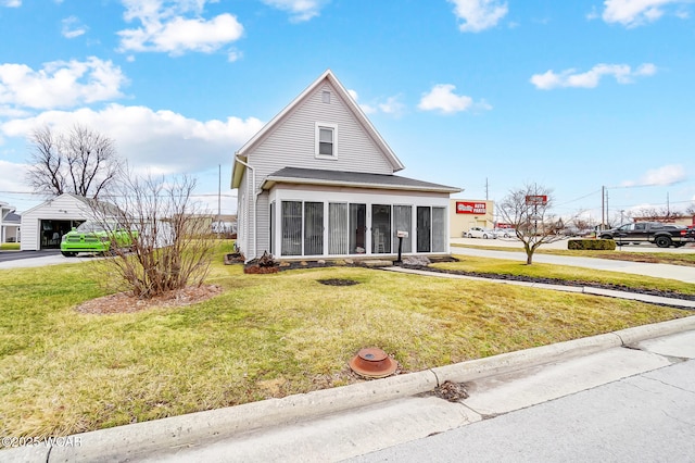 view of front of property with a front lawn and a sunroom