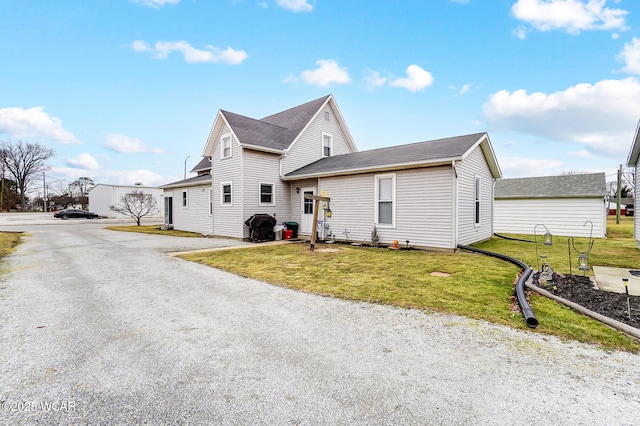 view of front of home with a front lawn