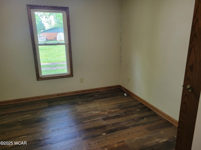 440 Edwards St, Ada, OH 45810 - unfurnished room with healthy amount of natural light and dark wood-style flooring