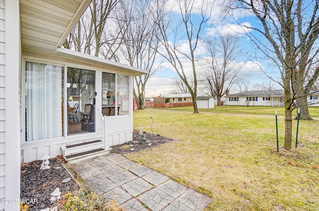 view of yard featuring a sunroom