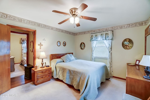 bedroom featuring ceiling fan and light colored carpet