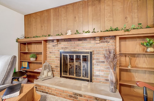 details featuring a fireplace and wood walls