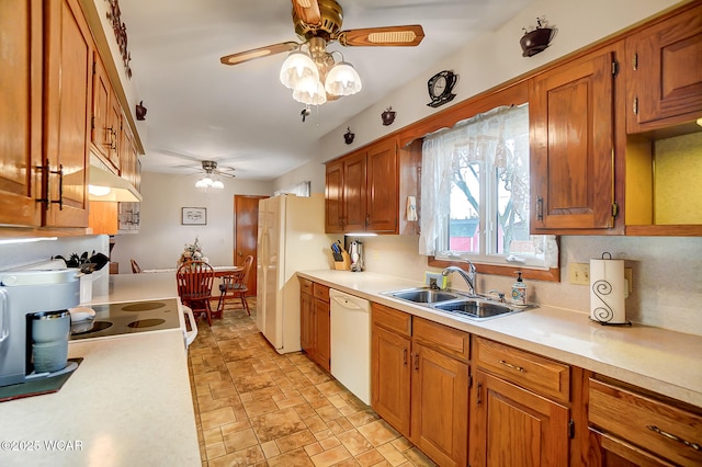 kitchen featuring ceiling fan, sink, and white appliances