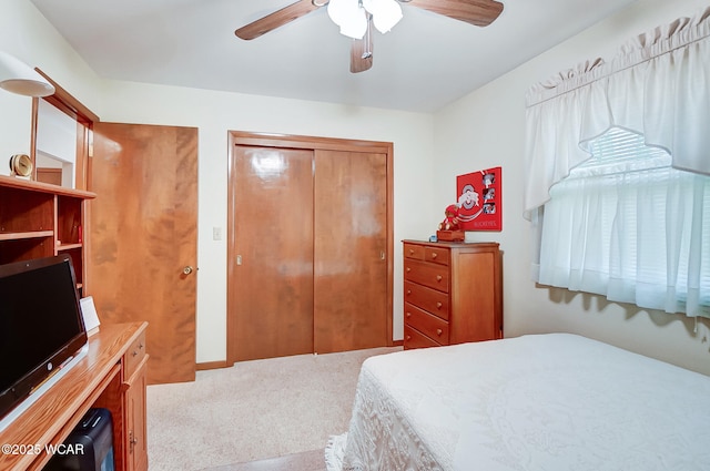 bedroom with carpet flooring, ceiling fan, and a closet