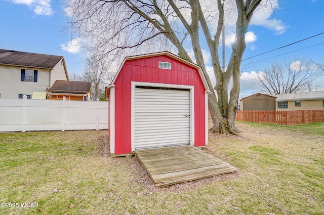 view of outbuilding with a lawn