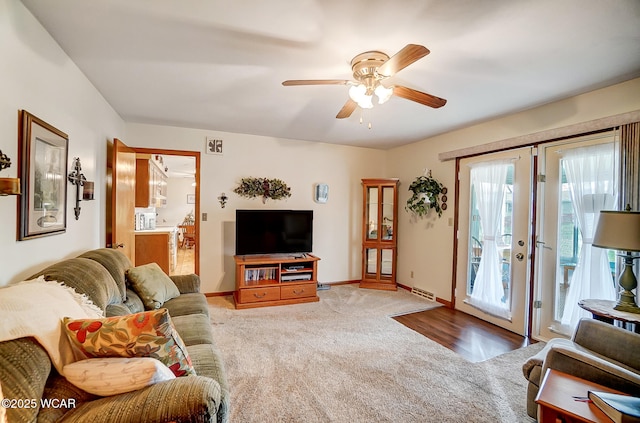 carpeted living room featuring ceiling fan