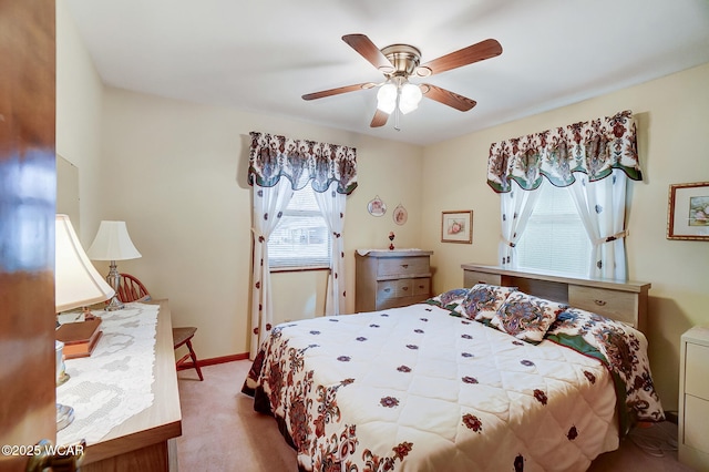 bedroom with light colored carpet and ceiling fan