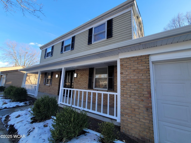 view of front of home featuring a garage and covered porch