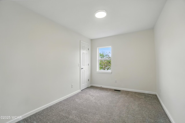 221 S Broadway St, Spencerville, OH 45887 - carpeted spare room with baseboards