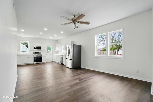 221 S Broadway St, Spencerville, OH 45887 - kitchen with appliances with stainless steel finishes, a ceiling fan, dark wood-style flooring, recessed lighting, and white cabinets