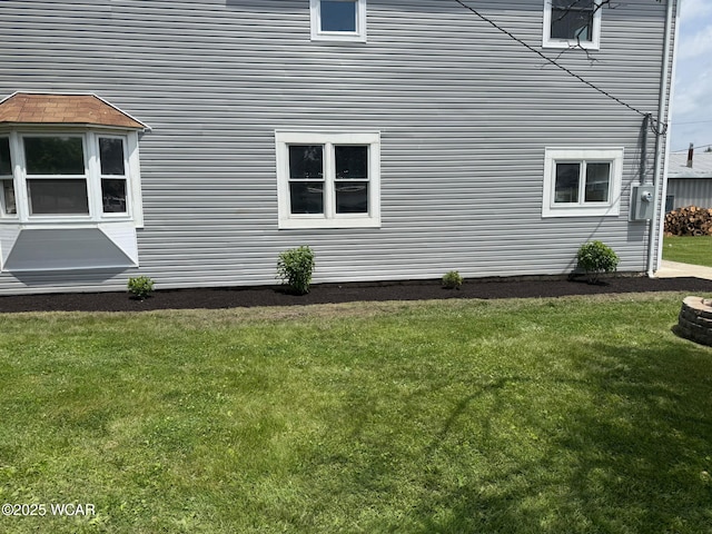 221 S Broadway St, Spencerville, OH 45887 - view of property exterior featuring a yard