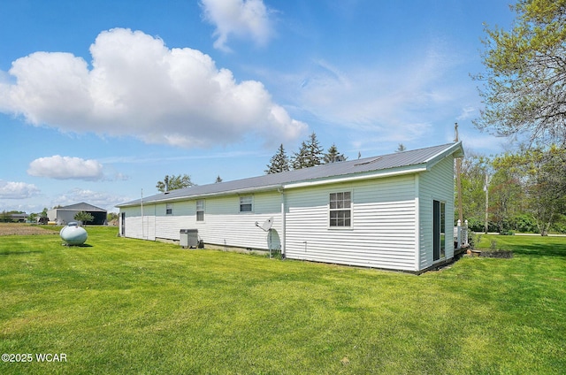 18698 Rd 48, Grover Hill, OH 45849 - back of property featuring a yard, metal roof, and cooling unit