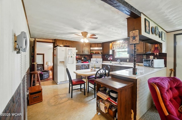18698 Rd 48, Grover Hill, OH 45849 - kitchen with white appliances, a sink, a peninsula, and light countertops