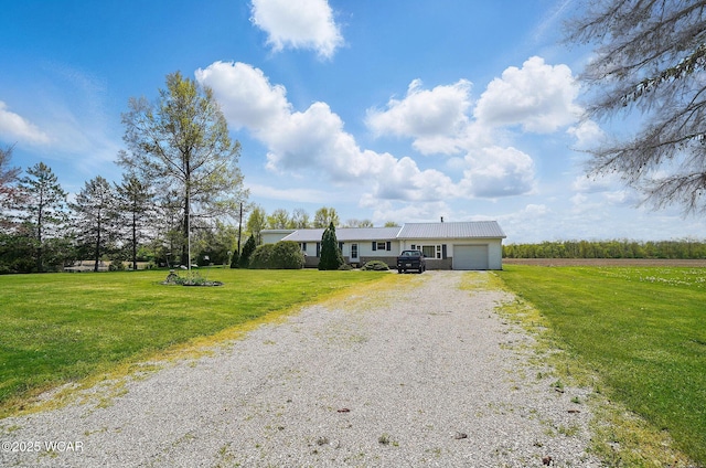 18698 Rd 48, Grover Hill, OH 45849 - single story home featuring driveway, an attached garage, a front lawn, and metal roof