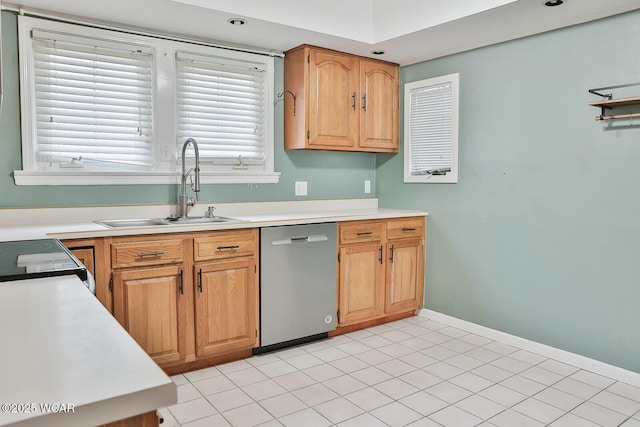 kitchen featuring appliances with stainless steel finishes, sink, and light tile patterned floors