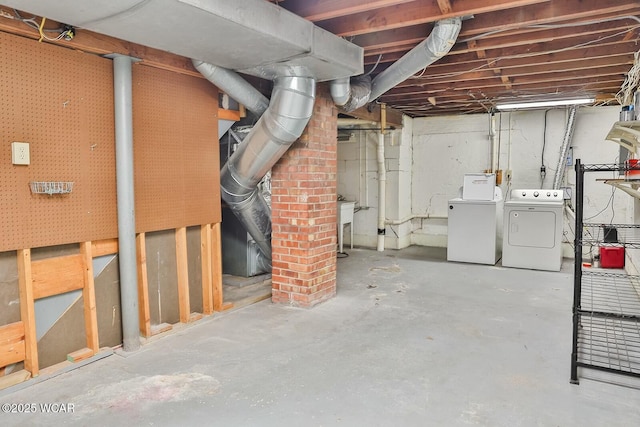 basement featuring washing machine and dryer