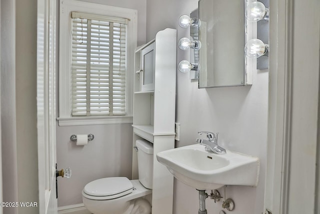 bathroom with sink and toilet