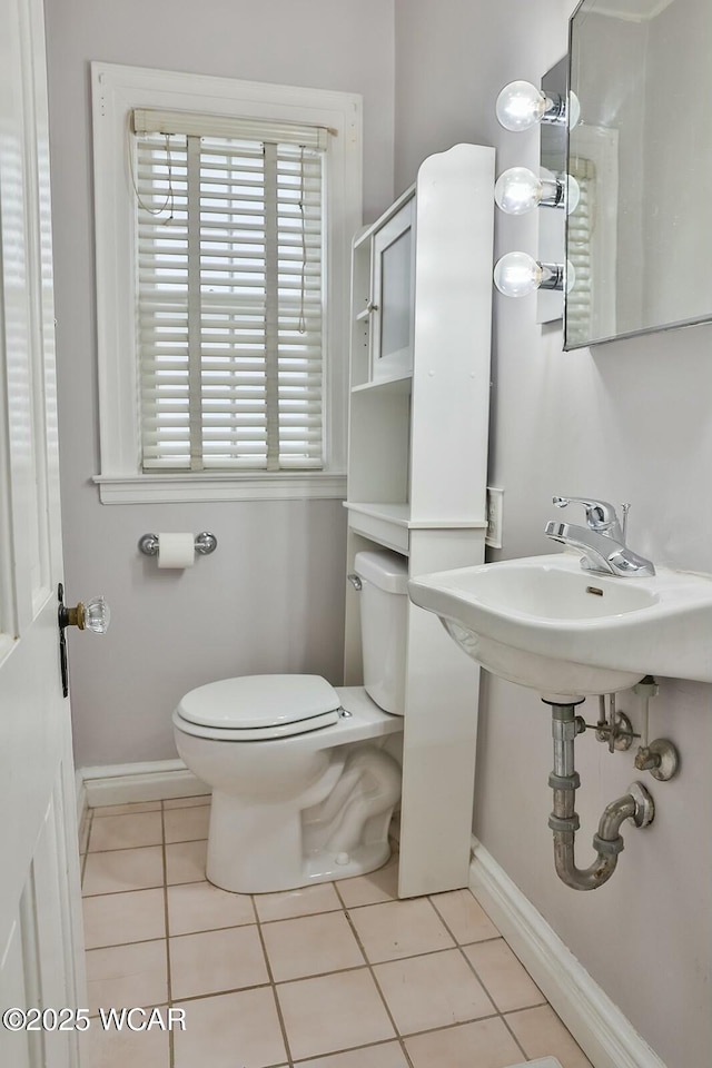 bathroom featuring tile patterned flooring and toilet