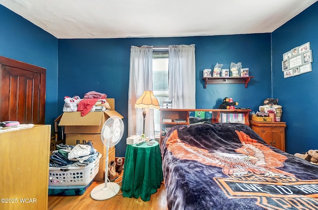 bedroom featuring hardwood / wood-style floors