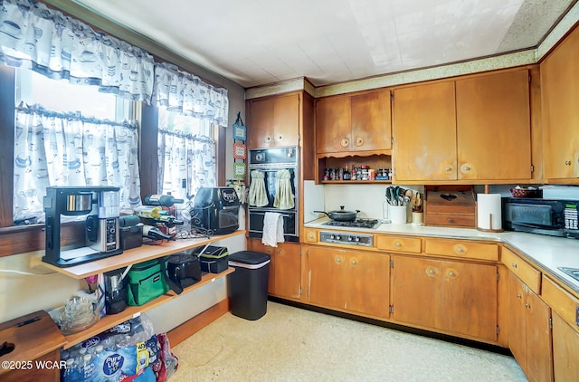 kitchen featuring double oven and gas cooktop