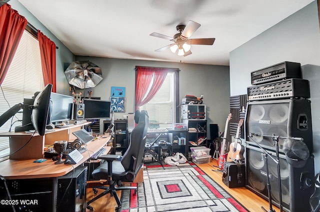 home office featuring ceiling fan and wood-type flooring